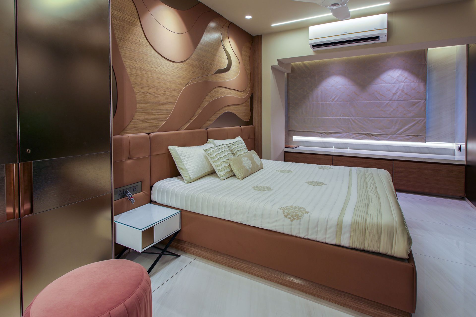 Elegant hotel room featuring modern design with accent wall and ambient lighting for a sophisticated atmosphere.